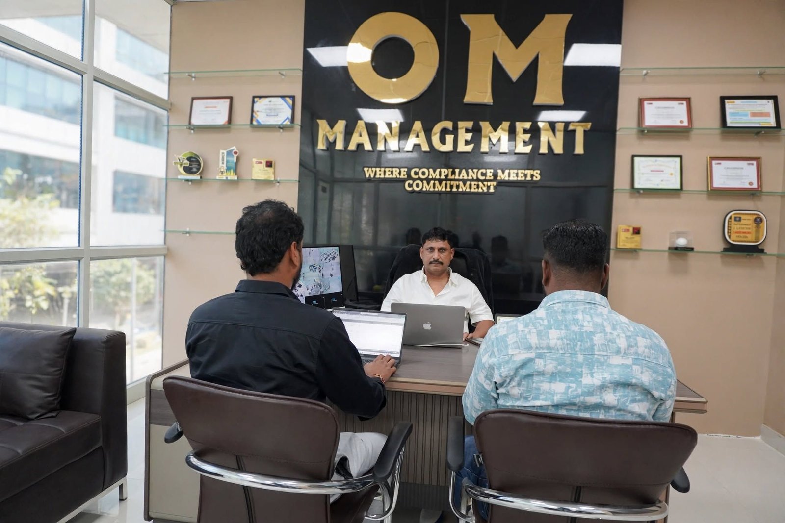 OM Management Financial Services — Client Meeting Logo Wall